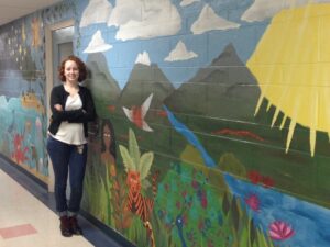 Claire Elam with mural